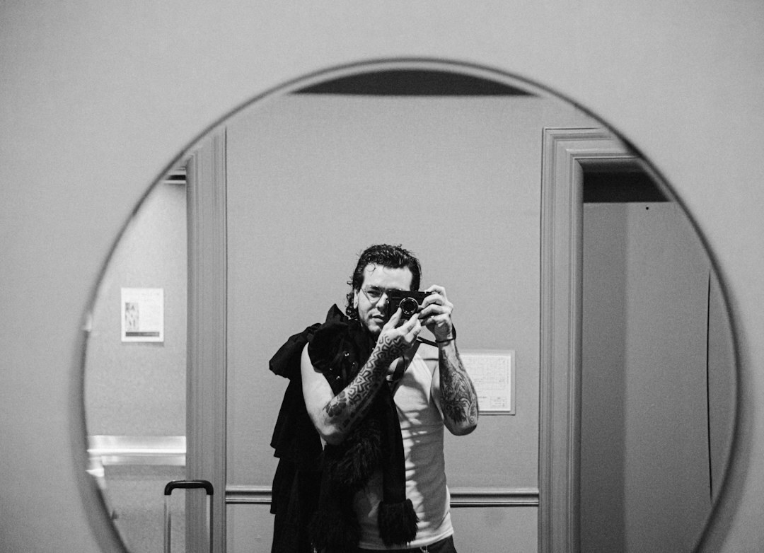 Studio portrait of a Latin American male photojournalist in his 20s
